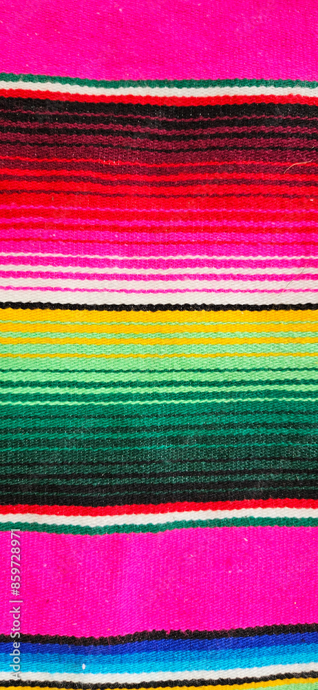 Serape Mexican blanket. Close up of a serape Mexican blanket pattern. Vibrant colours. Serape Mexican blanket. Close up of a serape Mexican blanket pattern. Vibrant colours.