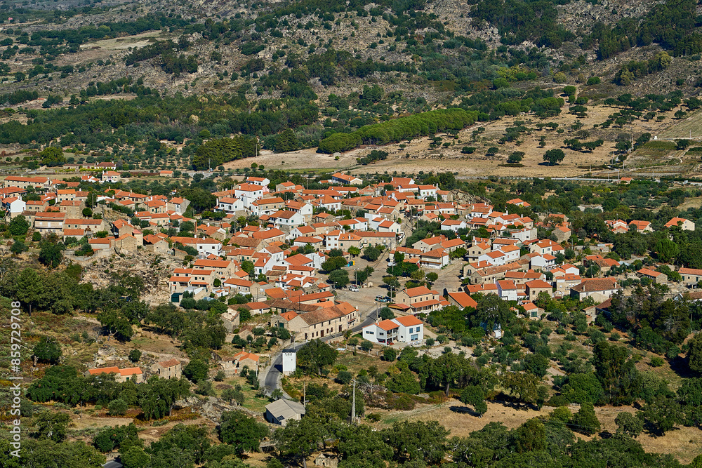 The medieval village of Monsanto is popular travel destination, known for its traditional houses build into the granite rocks of mountainous landscape in Portugal. The medieval village of Monsanto is popular travel destination, known for its traditional houses build into the granite rocks of mountainous landscape in Portugal.