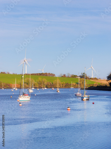 landscape with Windmill, boat, lake and clouds photo