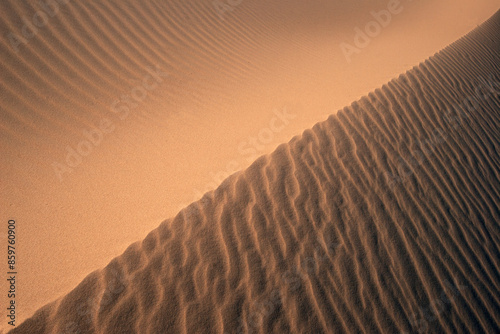 Sands of Time: Discover the intricate beauty of desert sand patterns, a natural artwork shaped by wind and time; The rhythm of shifting sands