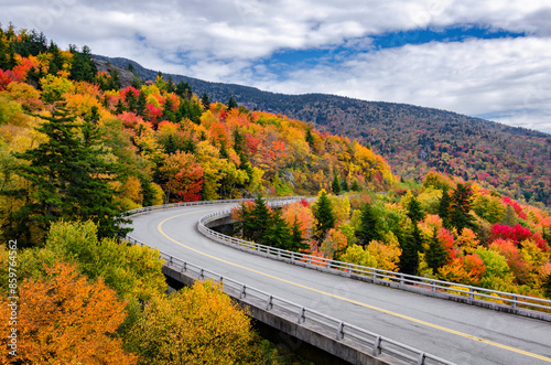 Winding road through peak autumn foliage, blue ridge parkway, north carolina