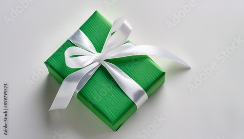 top view green gift box with white ribbon isolated on white background close up design element