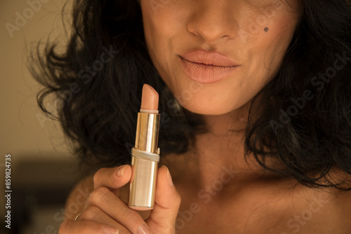 woman applying lipstick