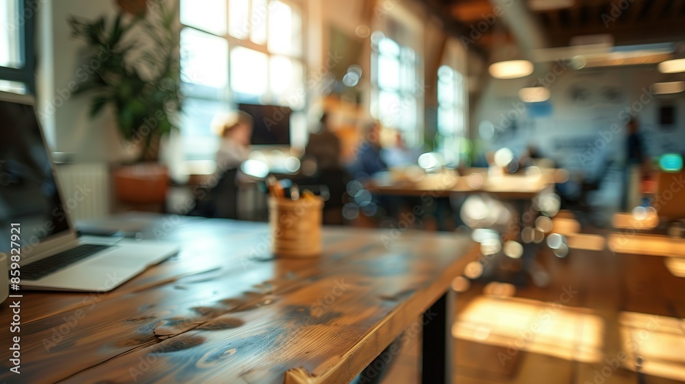 Blurred Office Interior with Wooden Table and Laptop Blurred Office Interior with Wooden Table and Laptop