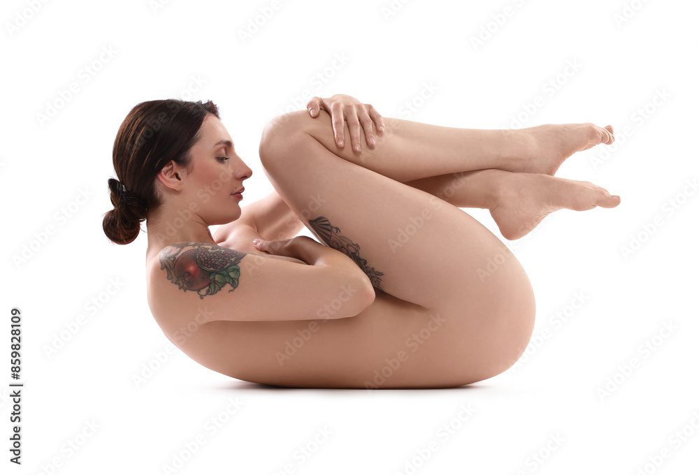 Obraz premium Beautiful nude woman with tattoos posing on white background