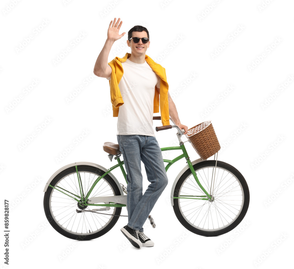 Smiling man in sunglasses near bicycle with basket isolated on white Smiling man in sunglasses near bicycle with basket isolated on white
