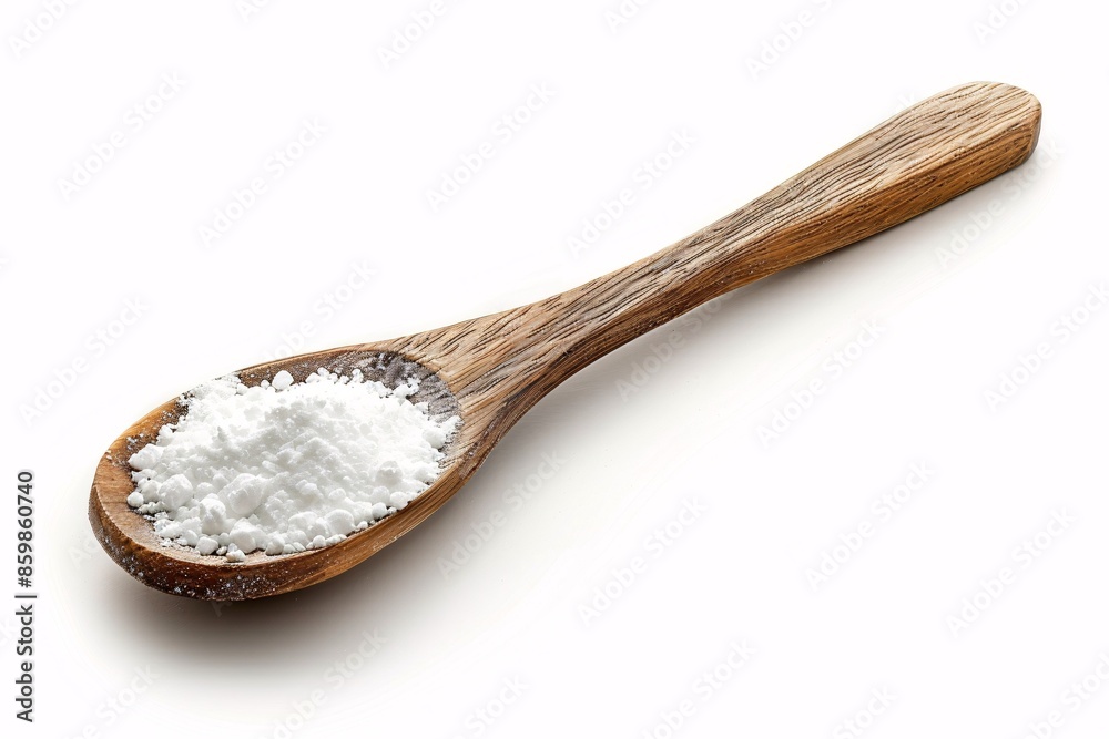 A spoonful of isolated baking powder seen from above. A spoonful of isolated baking powder seen from above.