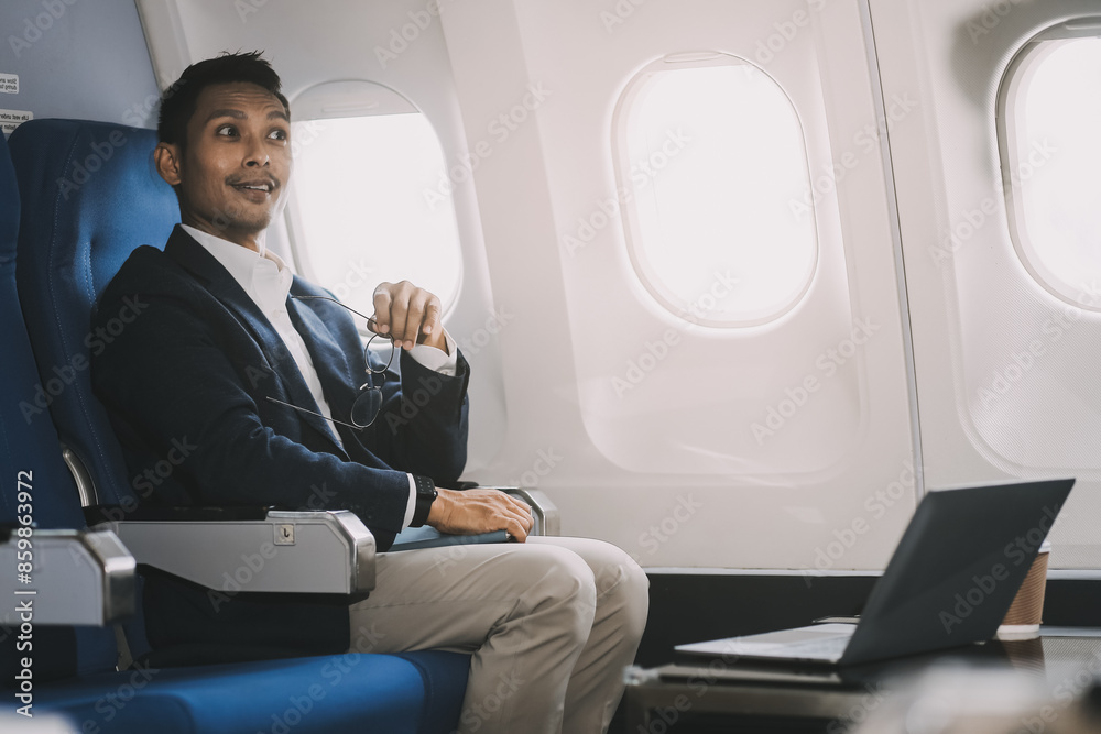 Business Man Having Headache Pain or Frustration Problem in Interior of an Airplane, Corporate Airline Travel Concept Business Man Having Headache Pain or Frustration Problem in Interior of an Airplane, Corporate Airline Travel Concept