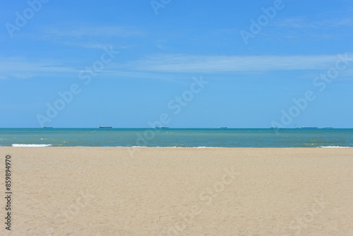 Beach waves of the sea on the sandy beach season Summer on top view background .