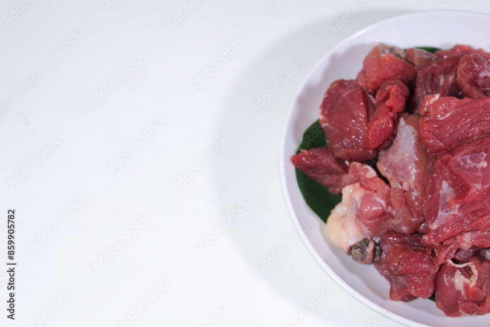 half a plate contains beef and lamb on a plain white background half a plate contains beef and lamb on a plain white background