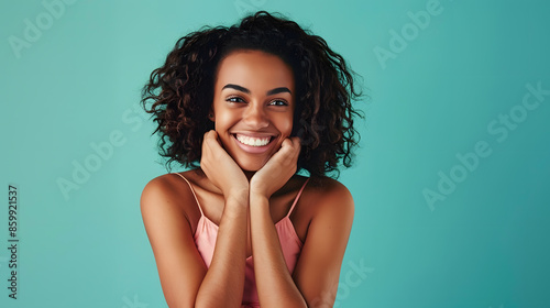 Smiling beautiful young woman in pink mini dress posing with hands on chin Three quarter length studio shot on turquoise background : Generative AI photo