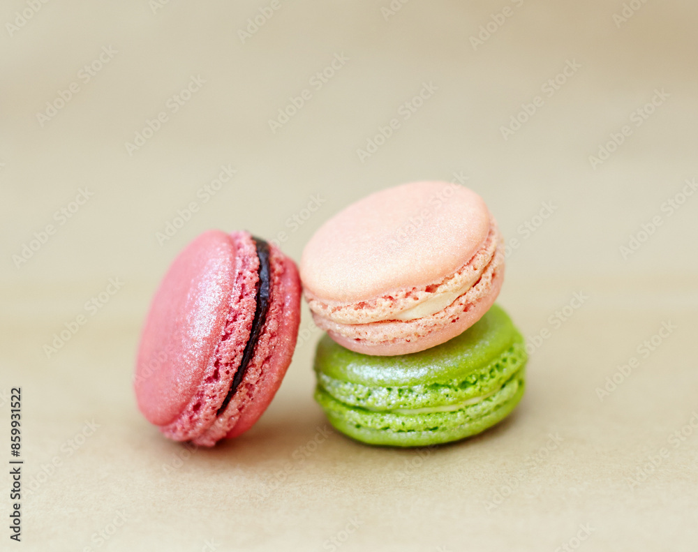 Macaroons, candy and stack of French sweets with variety, delicacy and treats on studio background. Baked dessert, luxury and different flavors of confectionery for bakery, fine dining and cookies Macaroons, candy and stack of French sweets with variety, delicacy and treats on studio background. Baked dessert, luxury and different flavors of confectionery for bakery, fine dining and cookies
