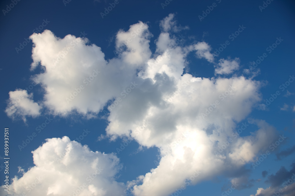 Nature, air and blue sky with clouds, sunshine and warm climate with meteorology on horizon. Heaven, dream and calm summer weather with environment, greenhouse effect and natural skyline in morning Nature, air and blue sky with clouds, sunshine and warm climate with meteorology on horizon. Heaven, dream and calm summer weather with environment, greenhouse effect and natural skyline in morning