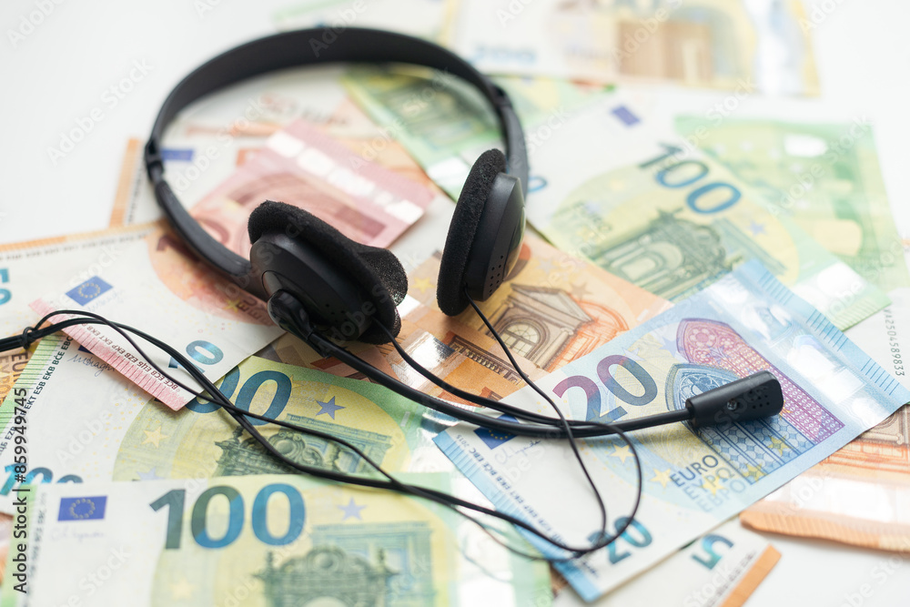 euro banknotes headphones headset. Money and technology still life concept. euro banknotes headphones headset. Money and technology still life concept.