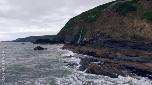 Drone footage of St George's Channel waves near Tresaith Waterfall in Tresaith, Wales, UK photo