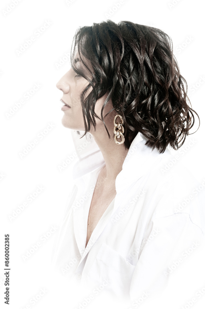 Portrait of a woman with dark hair, dressed in a white shirt, done in a high key. Portrait of a woman with dark hair, dressed in a white shirt, done in a high key.