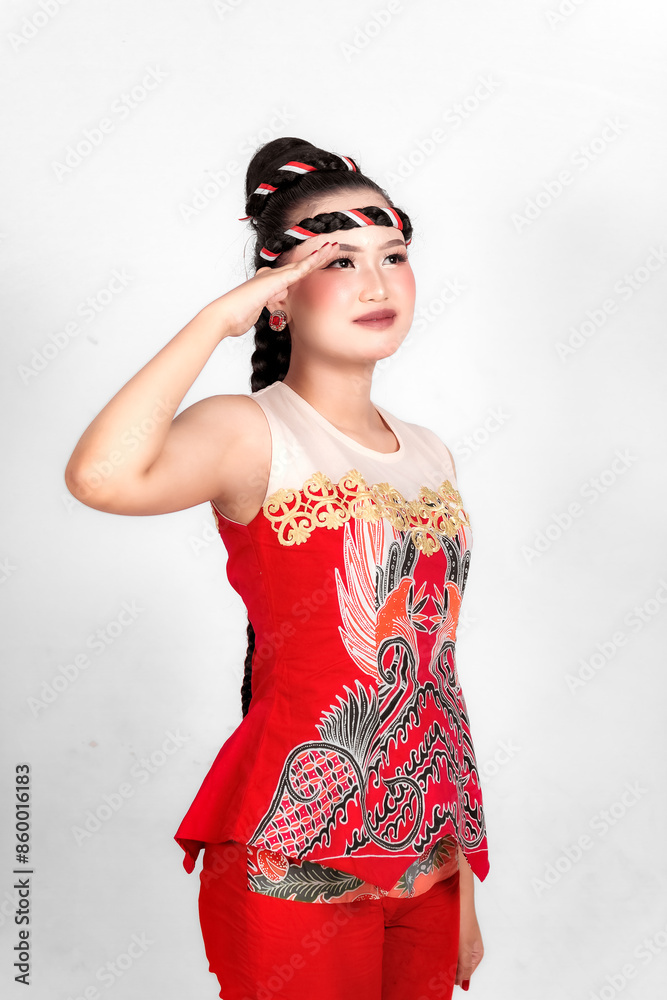 Beautiful Asian woman saluting celebrating Indonesia's independence day on August 17 isolated on white background