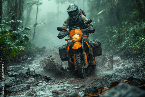 A driver motor cross motorcycle off road on a mud road in rain forest. photo