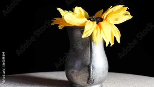 sunflower in a vase rotates on the turntable. 4k video capture