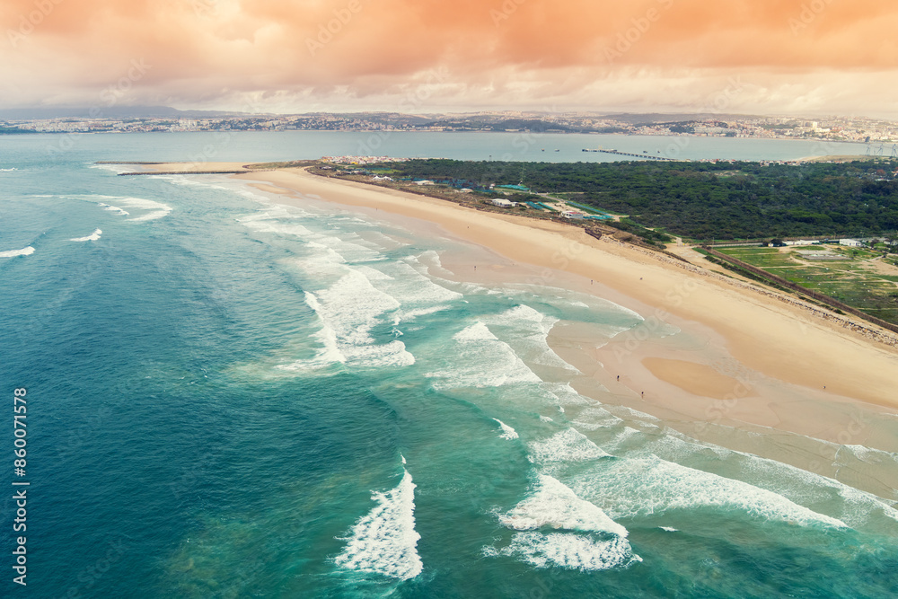 Aerial view of seascape in the evening. Seacoast of Costa da Caparica city. View of Lisbon. Almada, Portugal