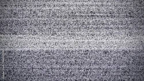 Old television screen being turn on and turn off with blip out. Snow or TV background noise. Analog TV out of tune.