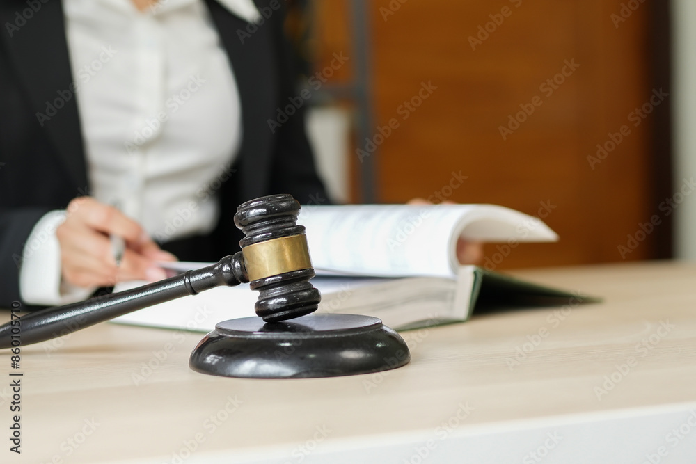 judge on wooden table And experienced lawyers meet with clients and give advice behind the scenes. legal services legal consulting concept judge on wooden table And experienced lawyers meet with clients and give advice behind the scenes. legal services legal consulting concept