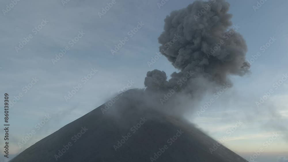 Aerial video of Volcan de Fuego erupting at sunset, Guatemala Antigua