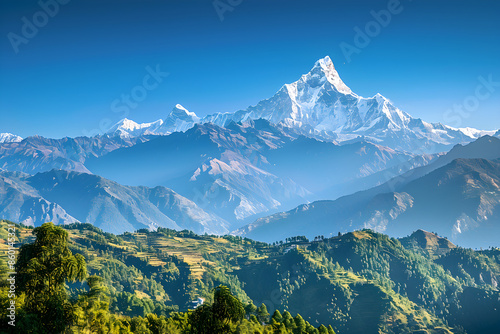 Symmetrical Mountain Range Under Clear Blue Sky with Snow-Capped Peaks and Scenic Foreground