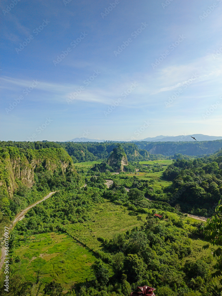 expanse of green hills and blue skies during the day, beautiful views from the top of the name Puncak Taruko Bukittinggi, Indonesia expanse of green hills and blue skies during the day, beautiful views from the top of the name Puncak Taruko Bukittinggi, Indonesia