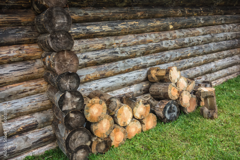 A woodpile of firewood near a village house. Rural life, rural landscape A woodpile of firewood near a village house. Rural life, rural landscape