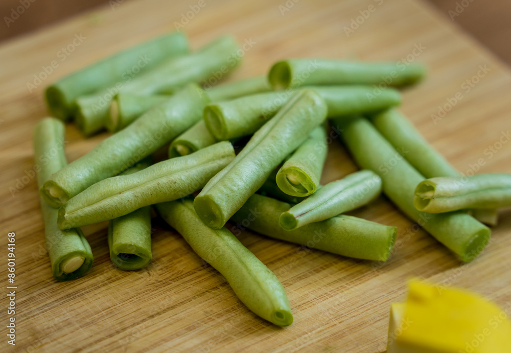 Fototapeta premium Cutting board with ingredients for preparing green curry with herbs and rice