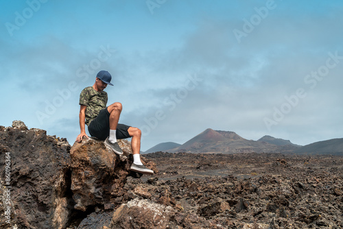 close up. Young man visits the desert landscape of  