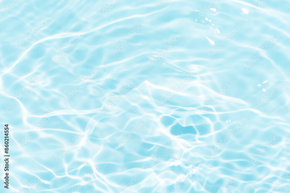 Blue water with ripples on the surface. Defocus blurred transparent blue colored clear calm water surface texture with splashes and bubbles. Water waves with shining pattern texture background. Blue water with ripples on the surface. Defocus blurred transparent blue colored clear calm water surface texture with splashes and bubbles. Water waves with shining pattern texture background.