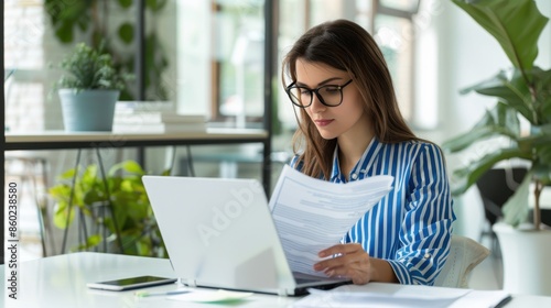 The woman reviewing documents