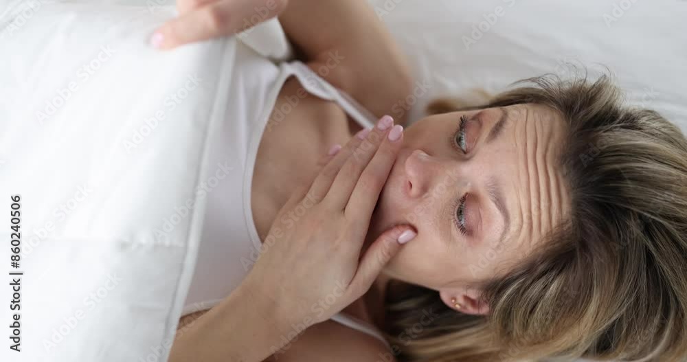 Young woman looking under covers and screaming 4k movie slow motion. Profuse uterine bleeding concept Young woman looking under covers and screaming 4k movie slow motion. Profuse uterine bleeding concept