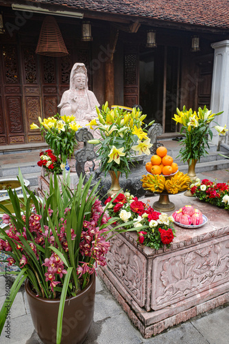 Hanoi, Vietnam - 29 Jan, 2024: Buddhist shrine at the One Pillar Pagona, Hanoi, Vietnam photo