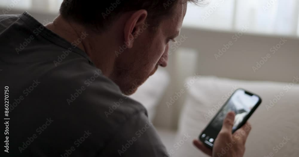 Intense Scrolling on Social Media. guy scrolling fast through social media on his smartphone. contemporary habits. addicted to fake news and scrolling social platforms. wasting time. screen time. 