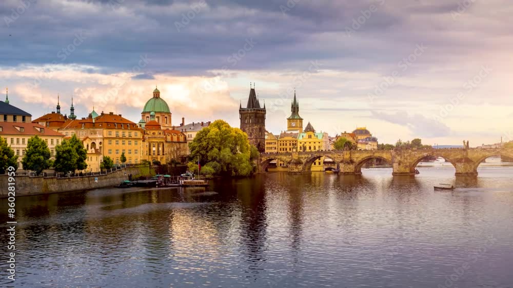 Golden summer sunset time lapse view of the cityscape of Prague with Charles Bridge and river Vltava, Czech Republic Golden summer sunset time lapse view of the cityscape of Prague with Charles Bridge and river Vltava, Czech Republic