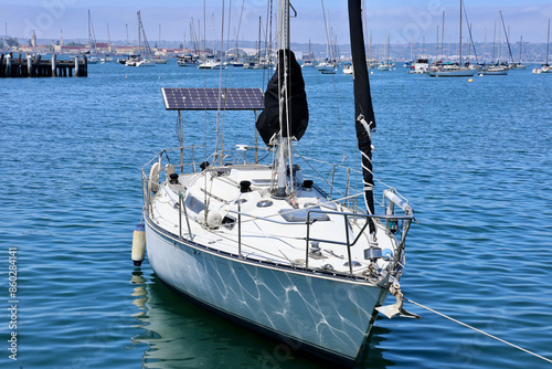 solar panels on a sailboat in the harbor