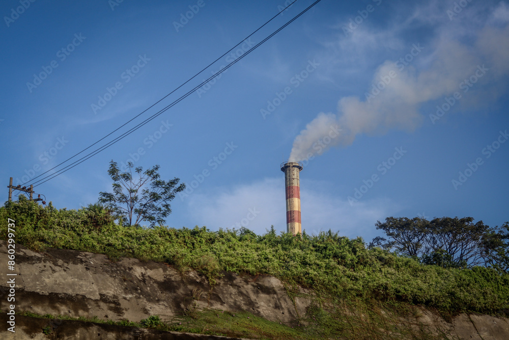 factory chimney emitting smoke pollution, perfect for environmental, industrial, and awareness projects, highlighting the impact of industrial emissions factory chimney emitting smoke pollution, perfect for environmental, industrial, and awareness projects, highlighting the impact of industrial emissions