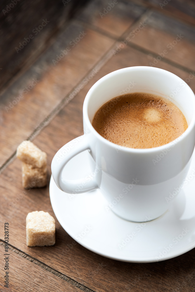 Cup of coffee on wooden background. Close up. Cup of coffee on wooden background. Close up.