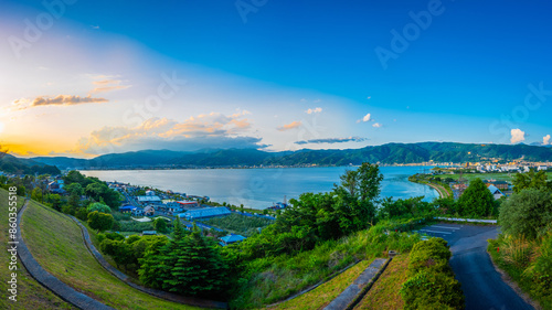 Panorama of Suwa lake in Nagano, Japan in sunset time with city and mountain background. Landscape photo photo