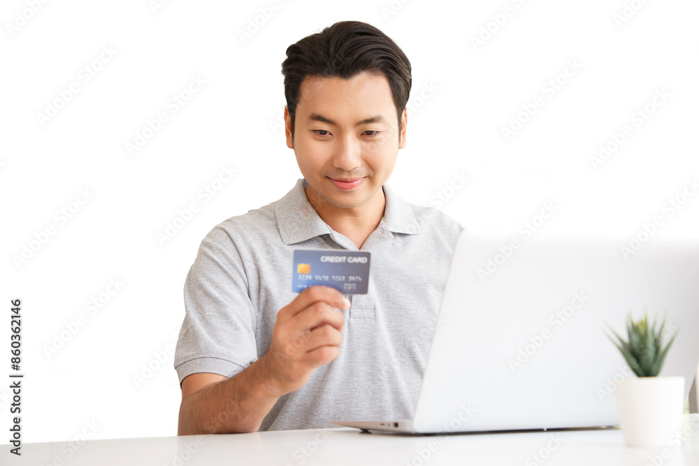 Happy cheerful smiling young adult asian man doing online shopping or e-shopping satisfied entrepreneur making online payment paying for service or goods on white background. Happy cheerful smiling young adult asian man doing online shopping or e-shopping satisfied entrepreneur making online payment paying for service or goods on white background.
