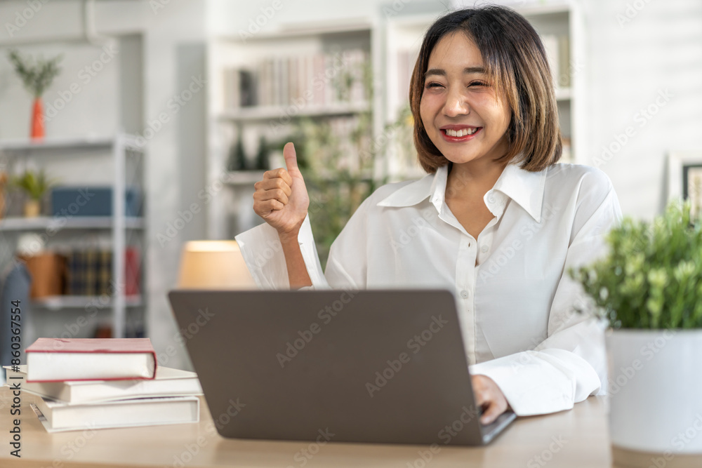 Young smiling asian woman happy relax use laptop conference work,learning, education, shopping, study online, webinar, online marketing, business, blog, digital internet advertising at home Young smiling asian woman happy relax use laptop conference work,learning, education, shopping, study online, webinar, online marketing, business, blog, digital internet advertising at home
