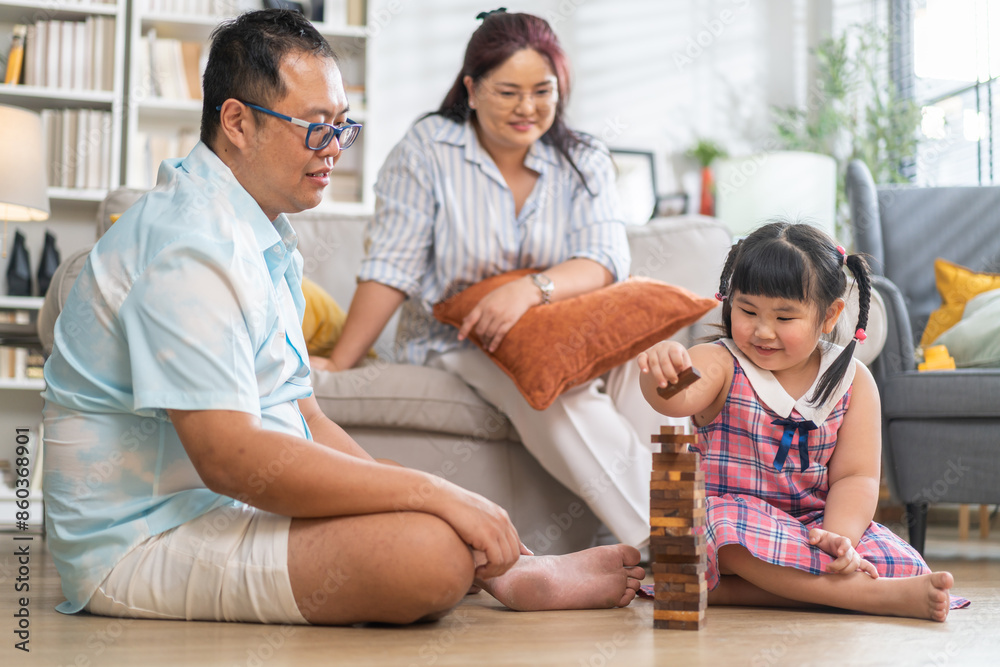Portrait of enjoy happy love asian family father and mother with little asian girl smiling activity learn and skill brain training play with toy build wooden blocks board education game at home Portrait of enjoy happy love asian family father and mother with little asian girl smiling activity learn and skill brain training play with toy build wooden blocks board education game at home