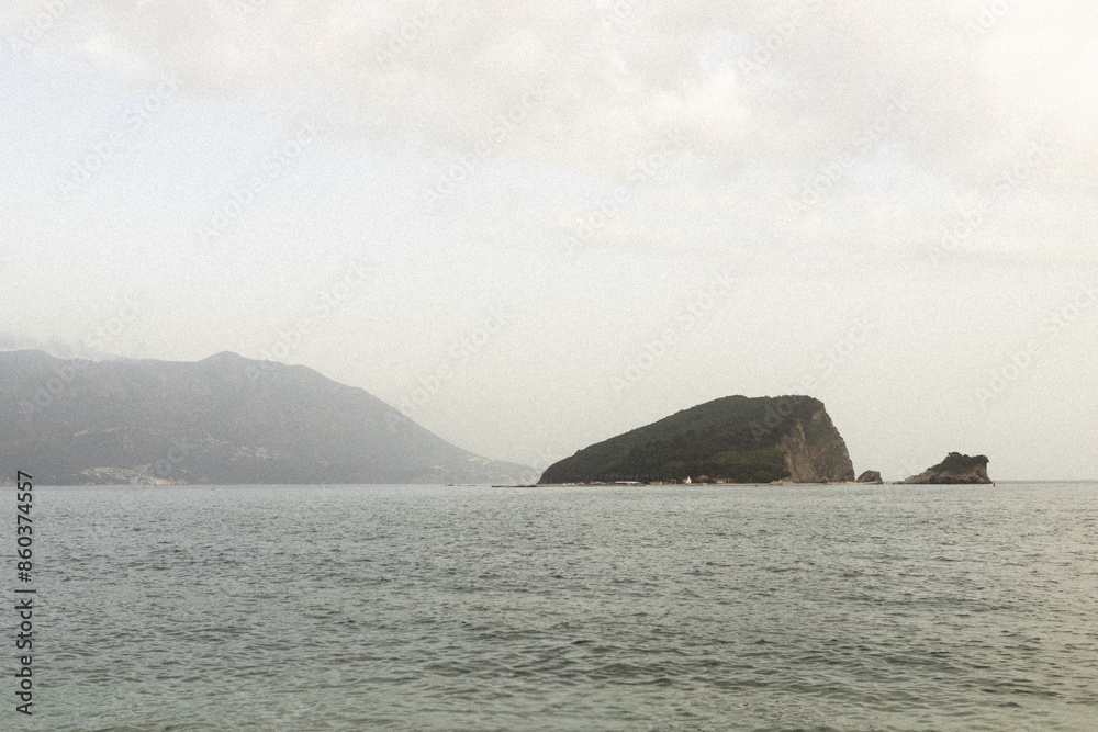 Aerial view saint nikola island in the sea near budva. cloudy weather Aerial view saint nikola island in the sea near budva. cloudy weather