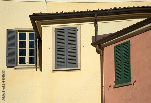 houses windows with wooden shutters photo