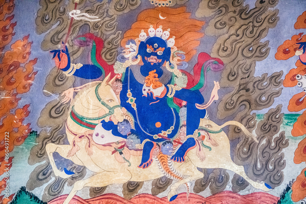 Obraz premium A detailed view of a vibrant tibetan deity Vajrapani painting displayed on a wall, Rangdum Monastery in Zanskar
