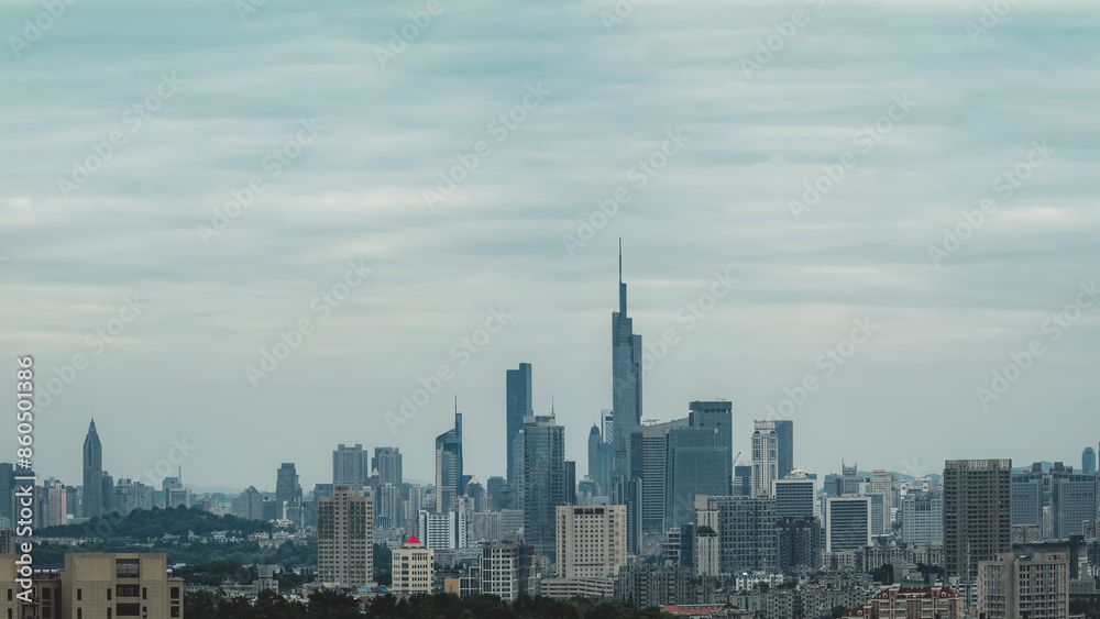 Obraz premium Modern Urban Skyline under Cloudy Sky