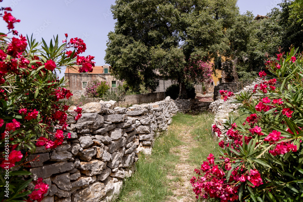 Strolling through the streets of the decaying village of Zirje on the island of the same name in Croatia